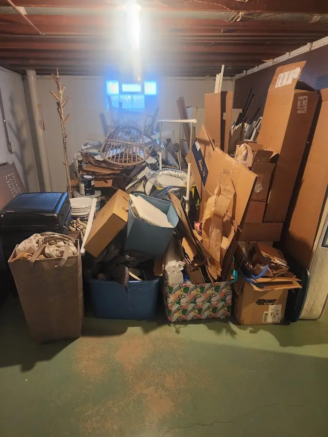 Roll-off dumpster container at job site for 2 Yard Dumpster Rental in Cadillac